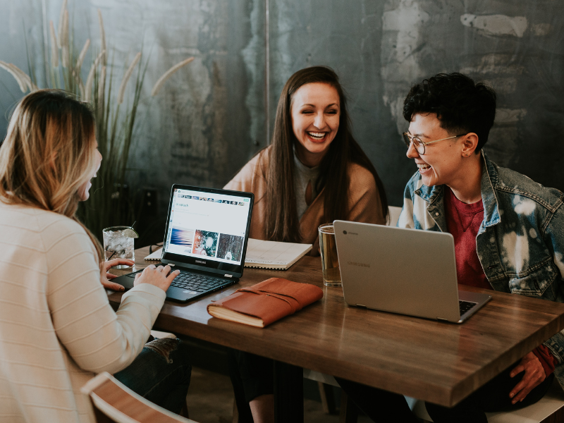 Students chatting at a desk